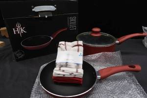 lot 216 image: BRAND NEW 8 SKILLET, USED PAN, AND DISHCLOTHES