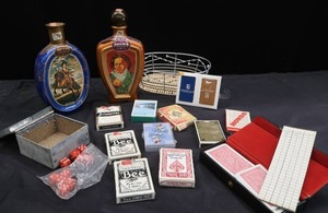 lot 227 image: BUNCH OF DIFFERENT COLLECTABLE PLAYING CARDS, DICE, AND JIM BEAM LIQUOR BOTTLES