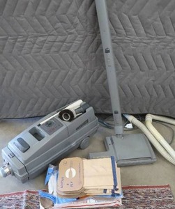 lot 280 image: ELCTROLUX CANNISTER VACCUME, BAGS AND RUGS