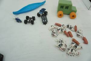 lot 131 image: Toy Lot trucks, cows, canoe, foam truck