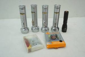 lot 206 image: Rayovac Flashlights, Giant Zippo Lighter, and Head Net