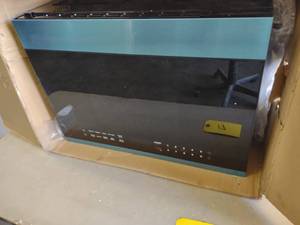 lot 17 image: Ikea Over The Range Microwave Oven,...