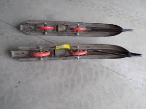 lot 111 image: Snowmobile skis with wheels.