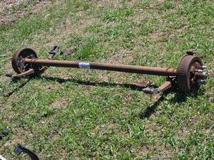 lot 38 image: Dexter 3500 lbs Capacity Trailer Axle with Drum Brakes HF  76.00, SC  59.50 Came out of 2019 Camper that was Put on a Trailer