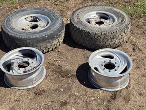 lot 62 image: Lot of 4 rims, 2 with LT26575R16 Tires  8x6.5 Bolt Pattern