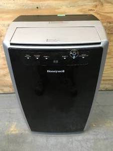 lot 41 image: Honeywell 14000 BTU 500-700 Sq. Ft. Portable Air Conditioner with Heating, Cooling, Dehumidifier & Fan Model # MN4HFS9