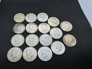 lot 59 image: Seventeen 40% Silver Kennedy Half Dollars