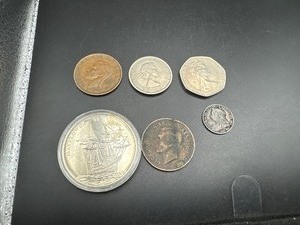 lot 91 image: Six Good Quality Foreign Coins 1900 GB 6 Pence, 1942 and 1943 Australia Kangaroo Large Cents, 1966 GB 2 Shilling Florin, 1970 GB 50 Pence, and 2000 $5 Liberia Mayfower