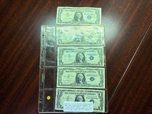 lot 97 image: Five 1957 B Blue Seal Silver Certificates