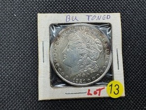 lot 13 image: 1921 Morgan Silver Dollar -  Marked BU Toned When Purchased