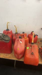 lot 29 image: Collection of 8 Plastic and Metal Gasoline Fuel Cans