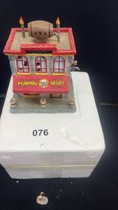 lot 76 image: Department 56 Dickens Village Flamin Skull Pub with Accessories