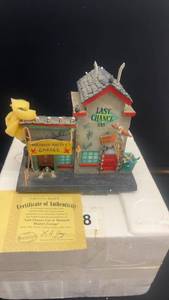 lot 78 image: Department 56 Madman Martys Garage and Gas Sculpture with Certificate