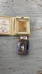 lot 127 image: Limited Edition Kevin Garnett Bronze Mint-Card and Randy Moss Action Figure