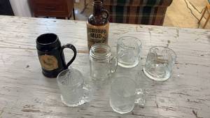 lot 132 image: Collection of Drinkware Including Mississippi Mud Jug, Minnesota Mug, and Glass Mugs
