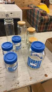 lot 153 image: Collection of 8 Glass Storage Jars with Wooden and Blue Lids