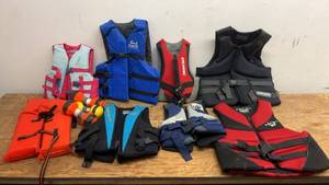 lot 186 image: Lot of 9 Various Life Jackets and Personal Flotation Devices