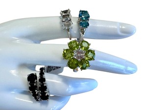 lot 12L image: Four Sterling Silver Rings with Beautiful Designs