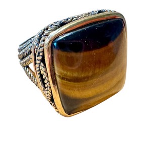 lot 19J image: Vintage Tiger Eye Cabochon Ring with Intricate Brass Design