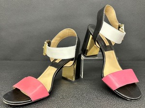 lot 7 image: Michael Kors Pink, Black and White Ankle Strap Block Heels with Gold Accents - Size 37