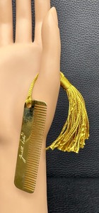 lot 13 image: Vintage Judith Leiber Gold Colored Purse Comb with Gold Tassel - Made in Italy