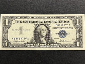 lot 38 image: 1957 Blue Seal $1 Dollar Silver Certificate Uncirculated