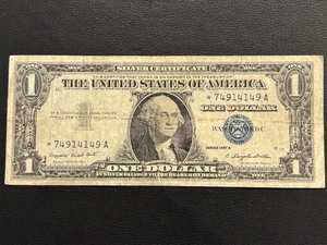 lot 39 image: 1957 A Blue Seal $1 Dollar Silver Certificate Star Note