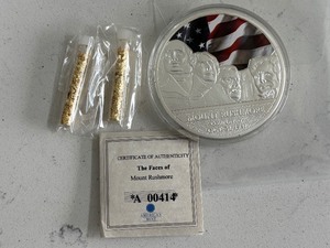 lot 197 image: Silver Layered Medallion and Gold Foil Tubes