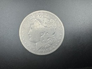 lot 69 image: 1890 O Morgan Dollar