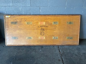 Table top with 40,640 Peso's in finish no legs