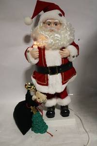 lot 275 image: 24 Animated and Musical Santa with Sack and Christmas Tree