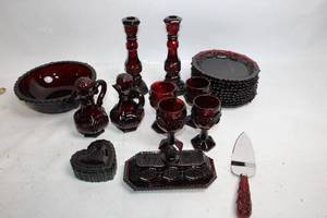 lot A-42 image: Collection of Ruby Red Glassware Including Goblets, Candlesticks, and Decorative Pieces