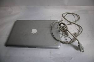 lot 150 image: Used Apple MacBook with Charger - Minor Exterior Damage