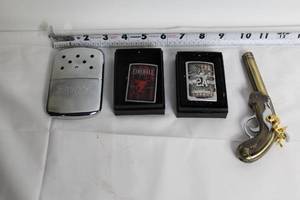 lot A-270 image: Collection of Zippo Lighters and Vintage Replica Pistol