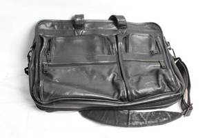 lot 297 image: Tumi Genuine Leather Black Briefcase with Multiple Compartments