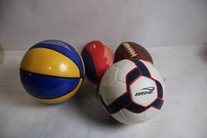 lot 41 image: Collection of 4 Sports Balls Soccer, Basketball, and Two Footballs