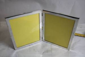 lot 75 image: Double Hinged Metal Photo Frame with Yellow Inserts