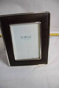 lot 77 image: Towle 5 x 7 Silver Plated Picture Frame with Faux Leather Border