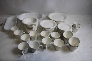 lot 172 image: White Dinnerware Set Includes Plates, Cups, and Bowls