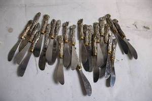 lot 186 image: Set of 18 Vintage Silver-Plated Butter Knives with Ornate Handles