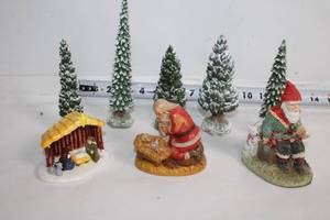 lot 234 image: Christmas Figurines Set with Trees, Nativity, and Santa Claus
