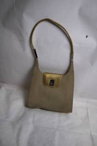 lot 298 image: Vintage Beige Handbag with Sleek Design