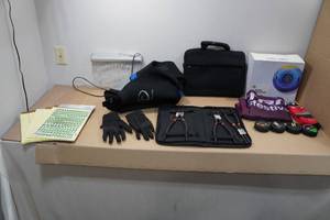 lot 242 image: Assorted - Snow Tube, Pucks, Tools, MN Wild Sign ,Wet Suit