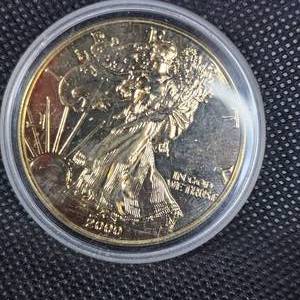 lot 23 image: 2000 Silver Eagle w24kt Gold Plating in Capsule