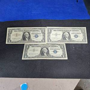 lot 105 image: (3)1957A $1 Silver Certificate Notes
