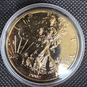 lot 143 image: 2002 Silver Eagle, 100% 24Kt Guilded Silver