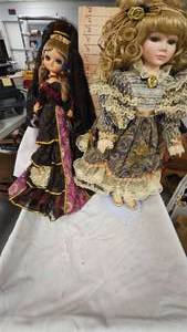 lot 33 image: Cintage Big Eye Bradley Doll and 20 Porcelain Doll