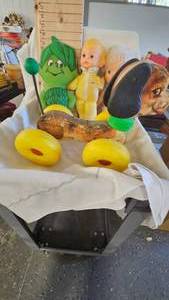 lot 132 image: Green Giant Stuffie, Dolls, and Fisher Price Wobble Dog