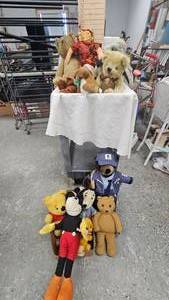 lot 146 image: Assorted StuffiesPostal BearSnoopyMickey Mouse and More