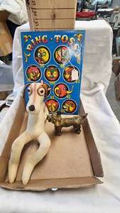 lot 225 image: Cast Iron Dog Striker Lighter and Ring Toss Game